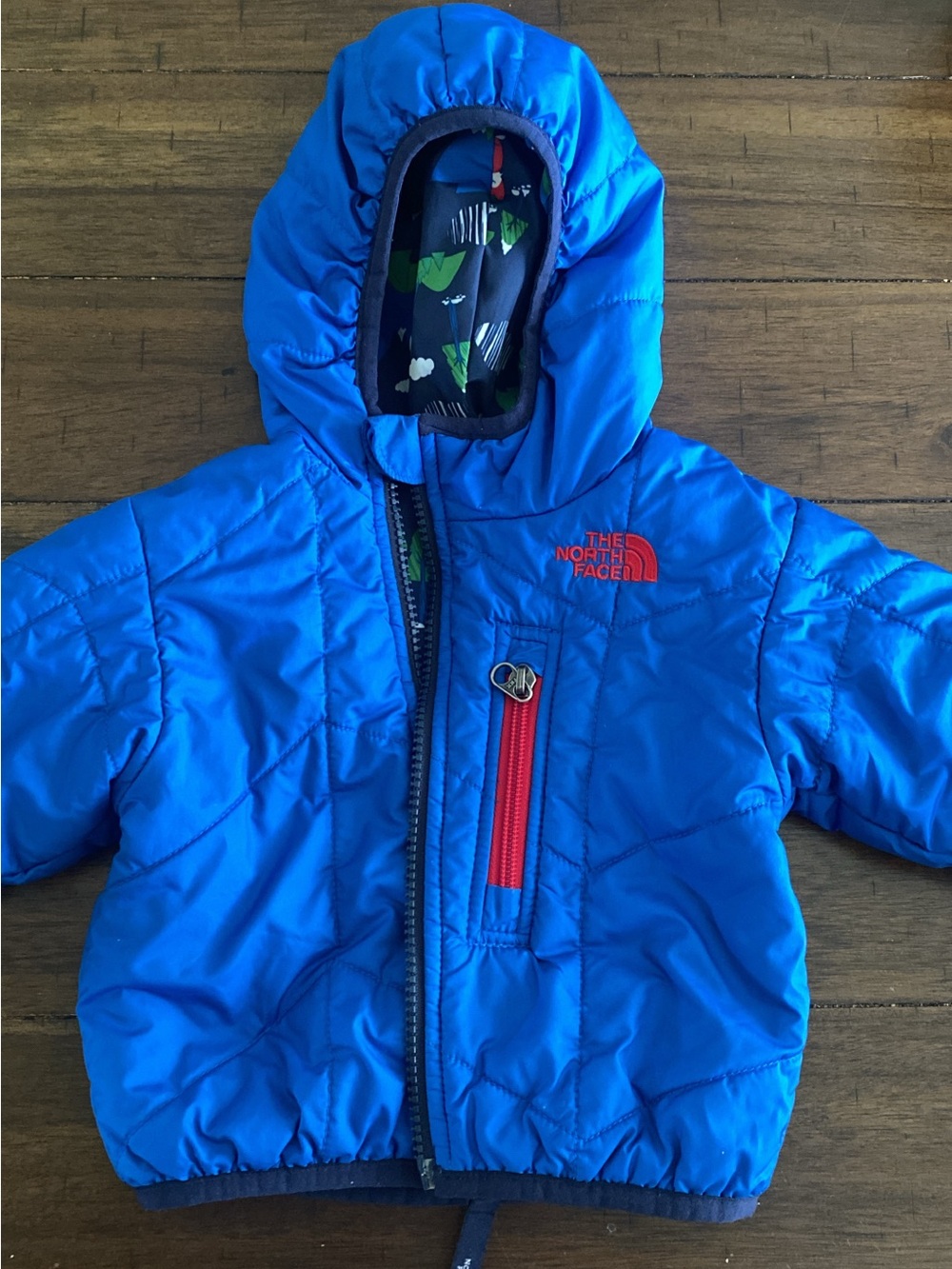 The North Face Bright Blue Hooded Puffer Jacket with Red Accents REVERSIBLE